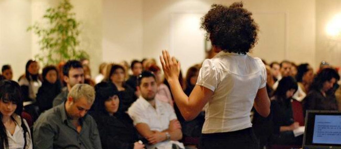 Presenter speaking to a seated audience at the milk_shake launch seminar